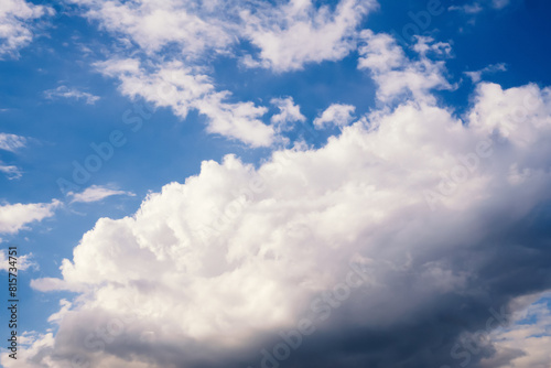 Large fluffy cumulus cloud in blue sky, nature background © bermuda cat