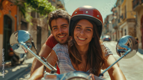 A couple young man and a woman riding a scooter together. They are both smiling. The background shows a street in the city with buildings around them. Pleasure of travel and vacati photo