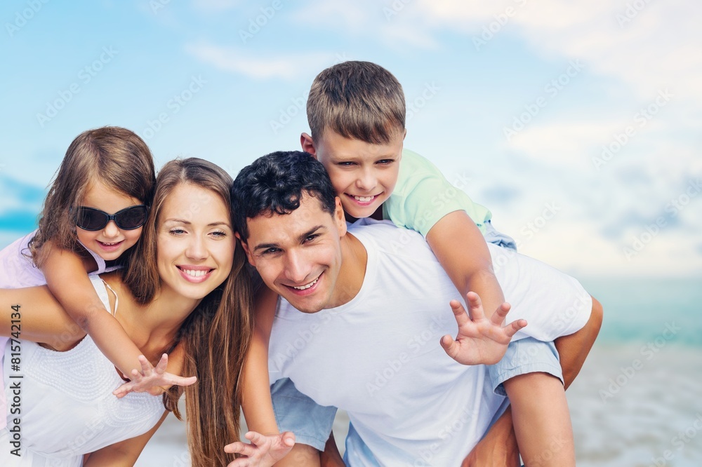 Happy family with children having fun on the beach Happy family with children having fun on the beach