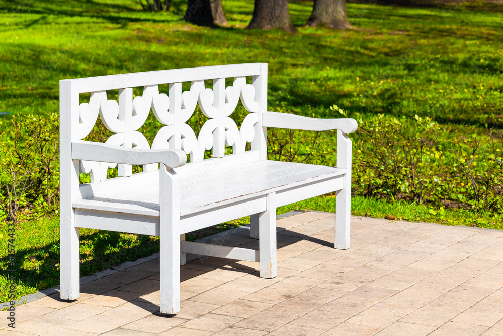 white wooden bench in the park without people white wooden bench in the park without people