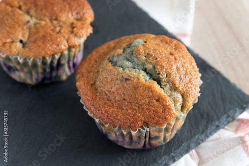 Delicious homemade blueberry muffin rustic background