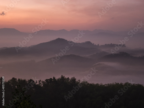 Sunrise scene with mountain and sea of mist on Southern of Thailand