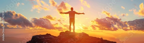Man standing on a mountain with his arms outstretched. Positive background. Banner 