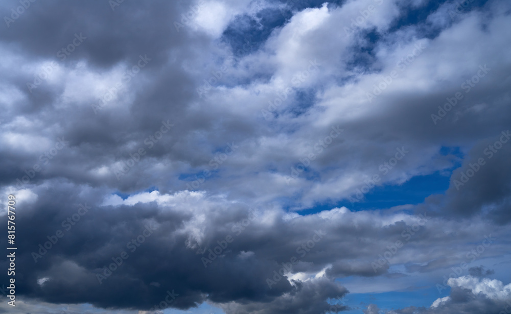 Obraz premium storm clouds float across the blue sky