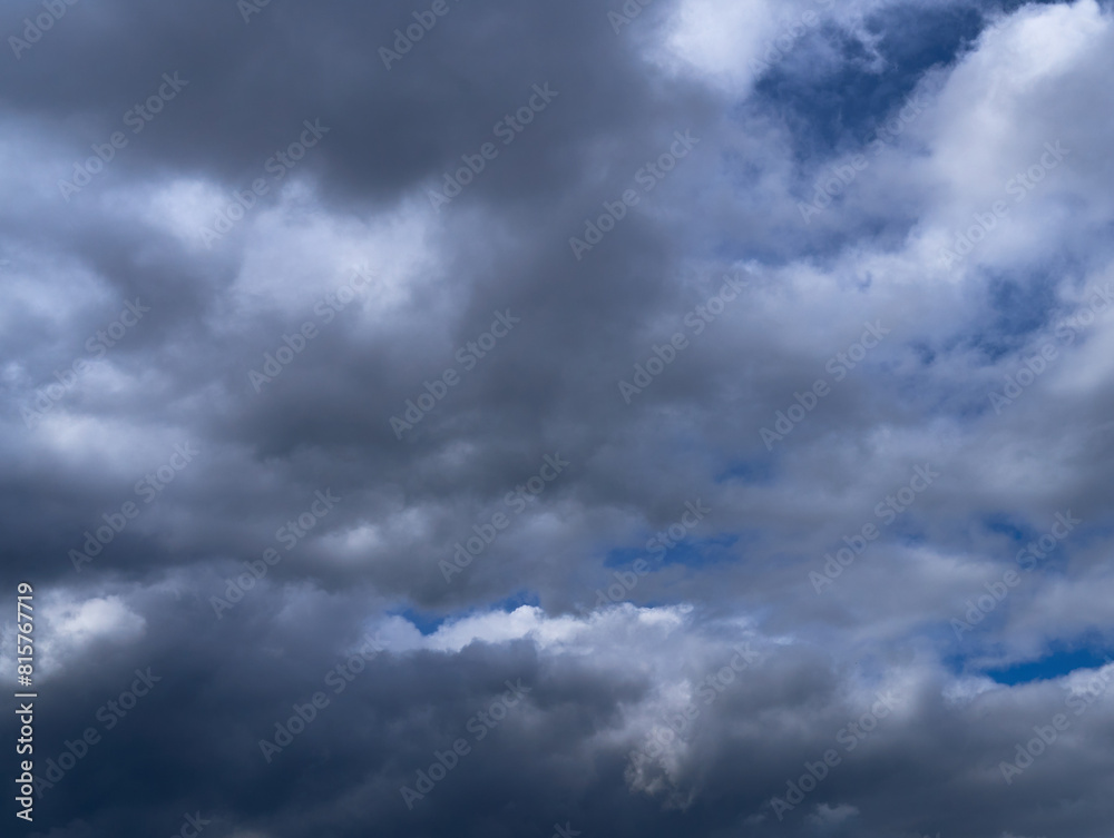 storm clouds float across the blue sky storm clouds float across the blue sky