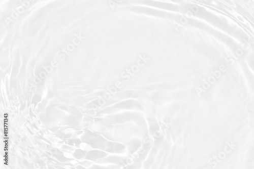 White water with ripples on the surface. Defocus blurred transparent white colored clear calm water surface texture with splashes and bubbles. Water waves with shining pattern texture background. 