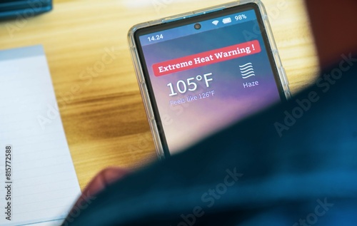 Canvas Print Excessive heat warning of 105 degree Fahrenheit with haze weather alert on smartphone screen