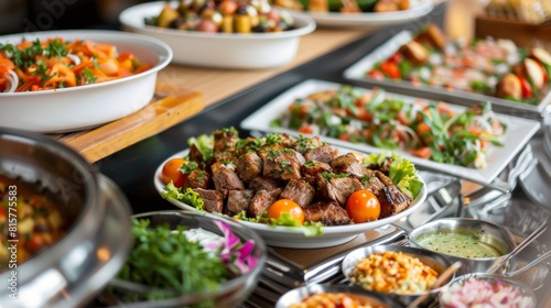 A variety of mouthwatering dishes are displayed on a buffet table, showcasing an array of flavors and textures. Different types of cuisine and ingredients are beautifully arranged for guests to enjoy