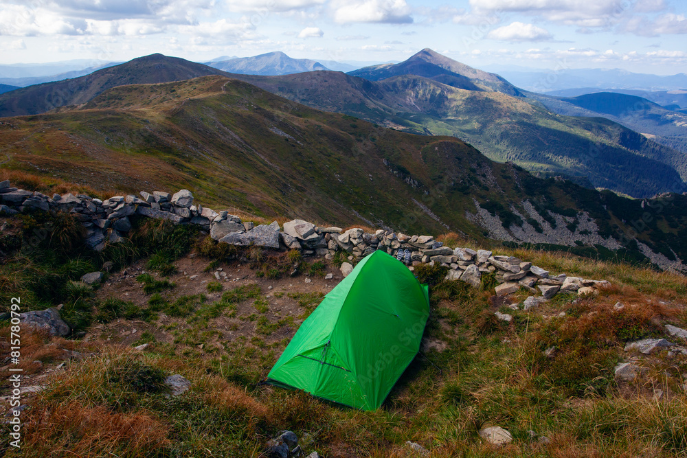 Green tent near Shpytsi with Hoverla view, Carathian mountains, Ukraine