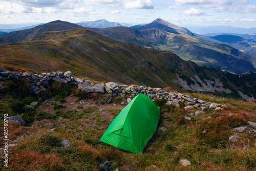 Green tent near Shpytsi with Hoverla view, Carathian mountains, Ukraine