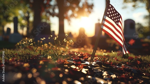 American flag on a grave in the cemetery at sunset. Selective focus.