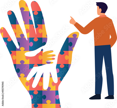 The boy is pointing at the puzzle autism aware hand.