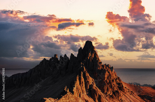 Colorful clouds filled with sunlight. Photo of the big dolomite mountains with majestic photo