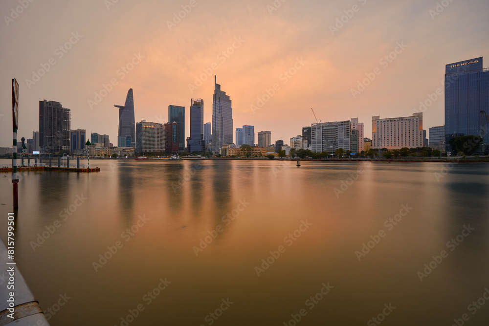 Ho Chi Minh City skyline and the Saigon River. Amazing colorful night view of skyscraper and other modern buildings at downtown. Travel concept Ho Chi Minh City skyline and the Saigon River. Amazing colorful night view of skyscraper and other modern buildings at downtown. Travel concept