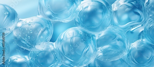 A copy space image of packaging with air bubbles on a blue background resembling bubble wrap texture and air bubble film © StockKing