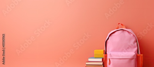 A school background with a pink backpack and colorful books provides ample copy space image potential © StockKing