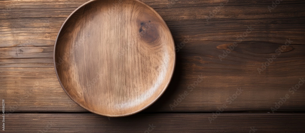 Copy space image Empty wooden dish displayed on a rustic wooden background