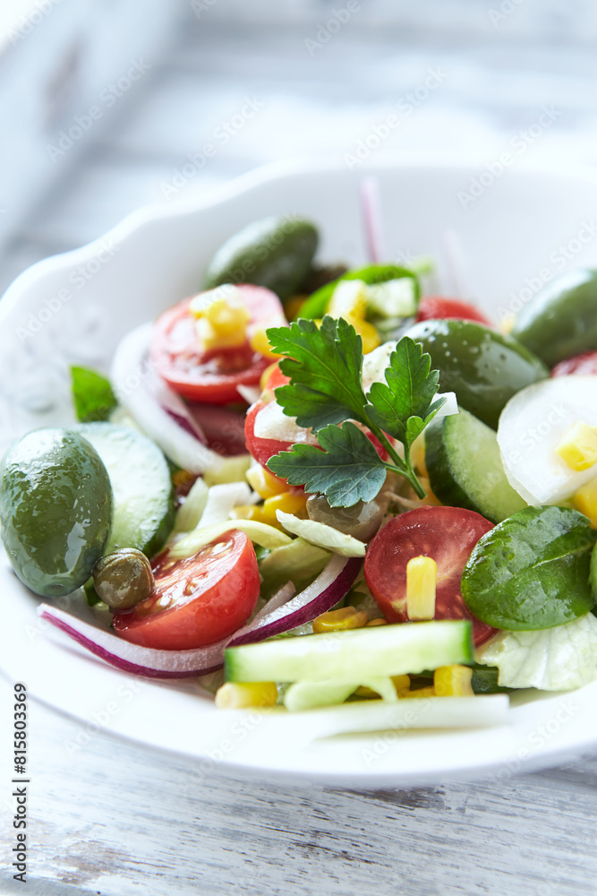 Simple Salad with Green Olives, Cucumber and Cherry Tomatoes. Bright wooden background. Simple Salad with Green Olives, Cucumber and Cherry Tomatoes. Bright wooden background.