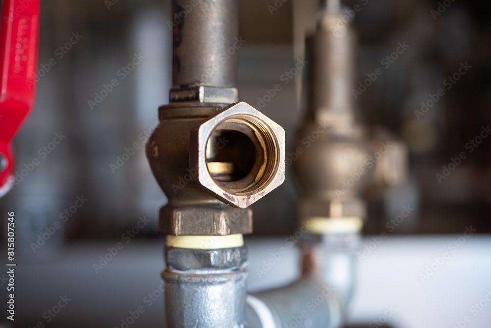 Copper plumbing open gate, close up shot, shallow depth of field, no people