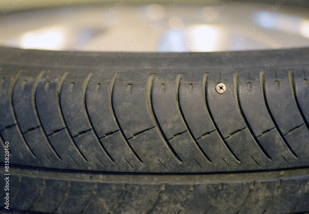 Prorosive car tire with almost no rubber tread and a retracted metal screw