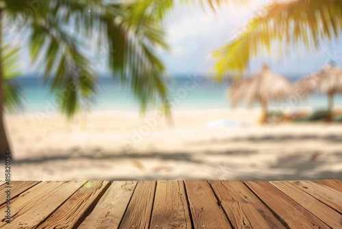 Empty wooden tabletop with bokeh lights on blurred beach and sea