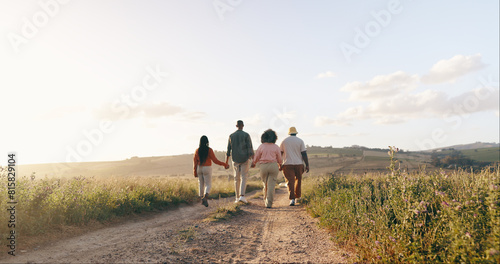 Group, friends and holding hands with vacation, back and summer break with adventure, fresh air and journey. People, outdoor and holiday with road trip getaway, trust and nature with mountains © peopleimages.com