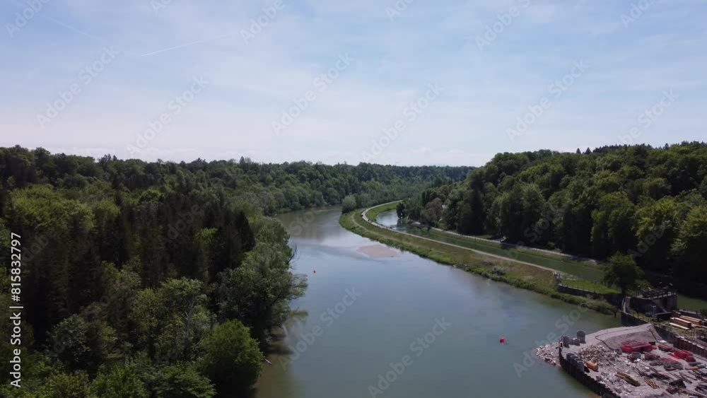 Isar river in Munich aerial view. South German river flowing down through a valley sorrounded by green forest