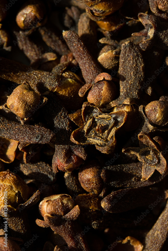 Background photograph of cloves. Concept of natural ingredients Background photograph of cloves. Concept of natural ingredients
