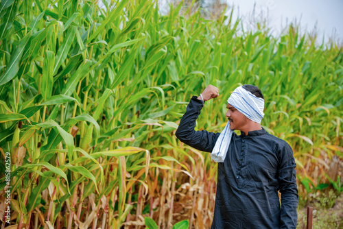 In a cornfield, a young Indian farmer