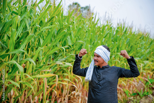 In a cornfield, a young Indian farmer