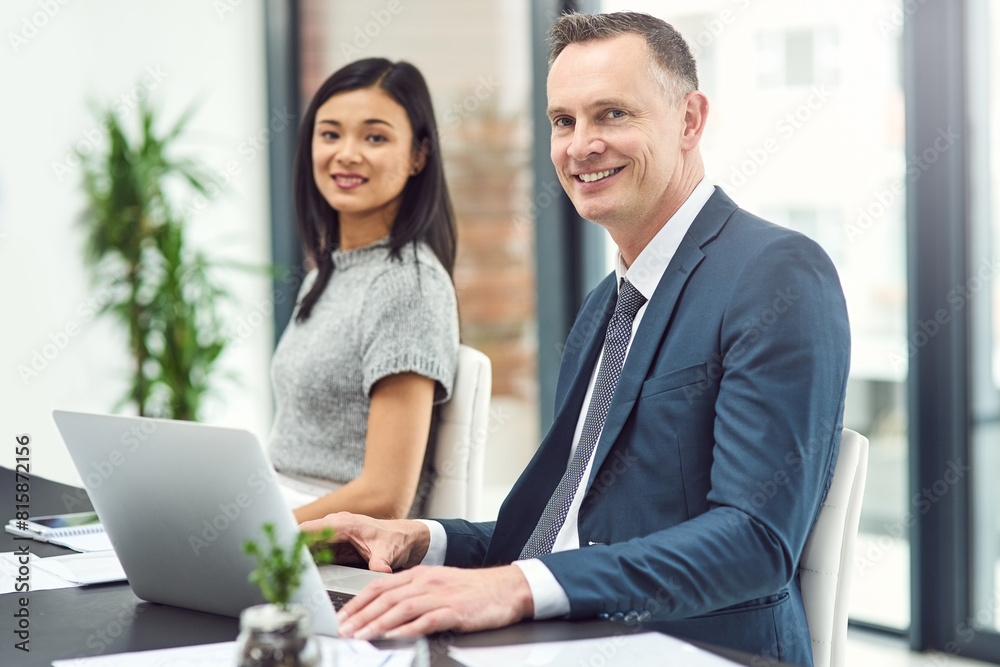 Fototapeta premium Businesspeople, meeting and portrait in office with smile at desk with manager or boss for teamwork. Leadership, interview or employee check in with tech, policy and happiness in job with confidence.