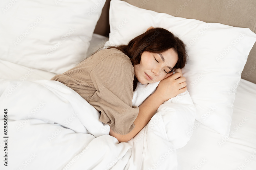 Peaceful Sleep: A Young Woman Resting Comfortably In A Cozy White Bed, Exuding Feelings Of Relaxation And Calmness, Perfect For Themes On Well-being And Healthy Lifestyle. Peaceful Sleep: A Young Woman Resting Comfortably In A Cozy White Bed, Exuding Feelings Of Relaxation And Calmness, Perfect For Themes On Well-being And Healthy Lifestyle.