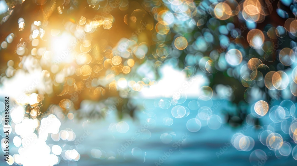 Blurry Abstract Background with Bokeh Effect of Light Filtering Through Trees and Blurred Ocean under a Sunny Sky Blurry Abstract Background with Bokeh Effect of Light Filtering Through Trees and Blurred Ocean under a Sunny Sky