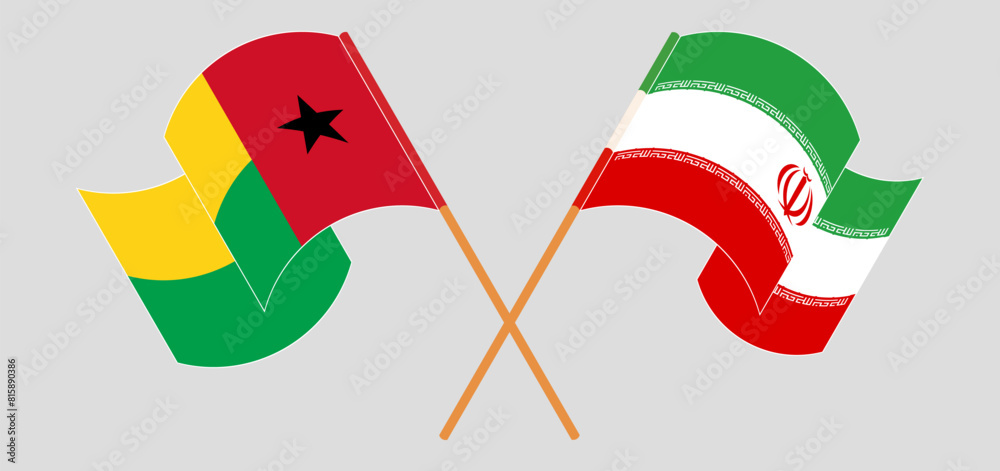 Crossed and waving flags of Guinea-Bissau and Iran Crossed and waving flags of Guinea-Bissau and Iran