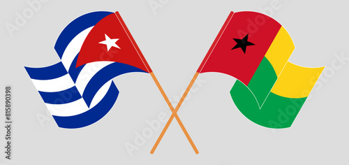 Crossed and waving flags of Cuba and Guinea-Bissau