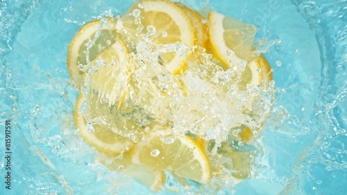 Freeze Motion of Lemon Slices Falling into Water, Splashing. © Jag_cz