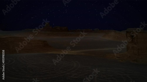 Aerial helishot, long shot above the sand dunes and sand rocks of the yardangs of the Lut plain of Iran. The endless desert at night bright stars. photo