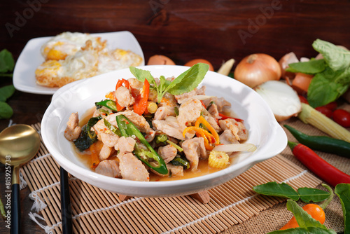 Stir-fried pork with basil, Thai food, fresh vegetables, ingredients on the table