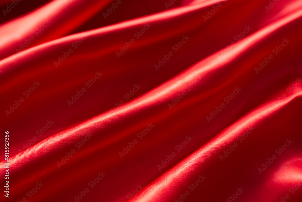 The bright red silk satin surface is beautiful and luxurious, wavy. For background and graphic work Blurry or blurry The bright red silk satin surface is beautiful and luxurious, wavy. For background and graphic work Blurry or blurry