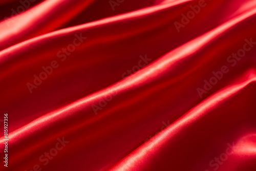 The bright red silk satin surface is beautiful and luxurious, wavy. For background and graphic work Blurry or blurry