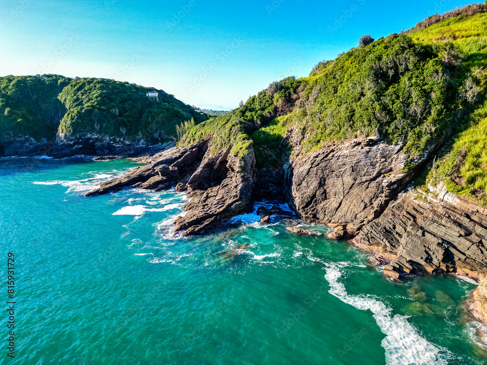Top down aerial view of a rocky coastline, stones with clear turquoise blue water, trees. Perfect for nature themes and background use. drone shoot Top down aerial view of a rocky coastline, stones with clear turquoise blue water, trees. Perfect for nature themes and background use. drone shoot