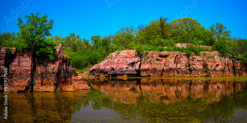 Fotografie Quartzite red rock excavation site remains at Gitchie Manitou State Preserve and