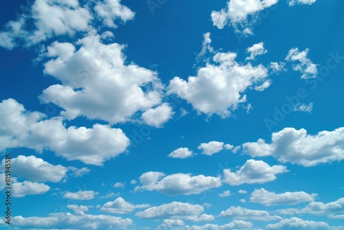 Vibrant blue sky dotted with soft white cumulus clouds  depicting calmness