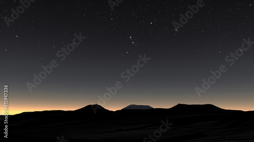 A serene night landscape with starry sky above silhouetted mountains and a hint of sunset on the horizon.