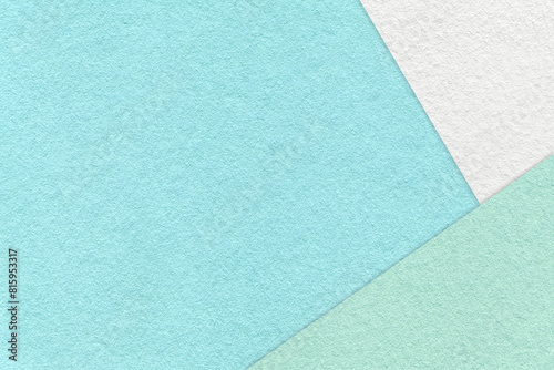 Texture of craft light blue color paper background with white, green and mint border. Vintage abstract sky cardboard.