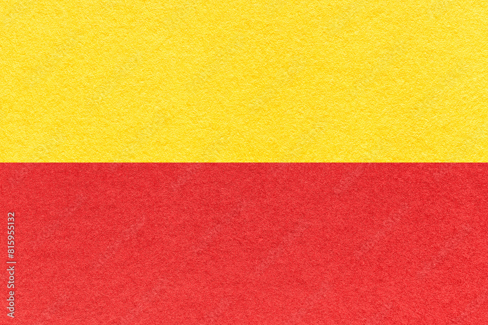 Texture of craft red and yellow paper background, half two colors, macro. Structure of vintage cardboard. Texture of craft red and yellow paper background, half two colors, macro. Structure of vintage cardboard.