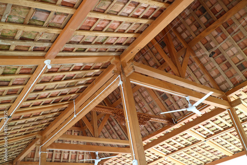 The roof of a simple building, the frame is made of wood. Roof tiles are made from clay © Adipra