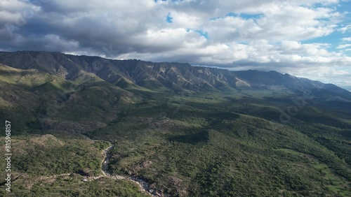 Paisaje de valle montañoso un dia con el cielo nublado. Montañas y bosque vista panoramica de dron. Sierras Grandes, Traslasierra, Nono, Córdoba, Argentina, Latinoamerica.  photo