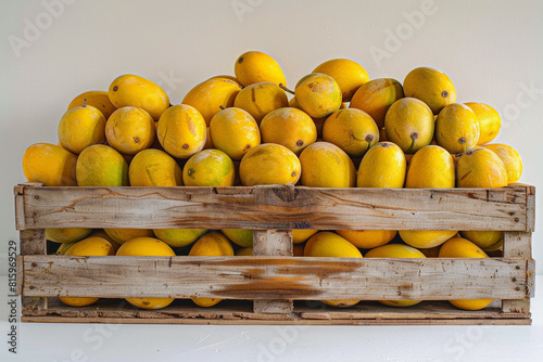 A rustic wooden crate brimming with ripe yellow mangoes  their sweet fragrance mingling with the air against a minimalist white backdrop  inviting a moment of tropical bliss in