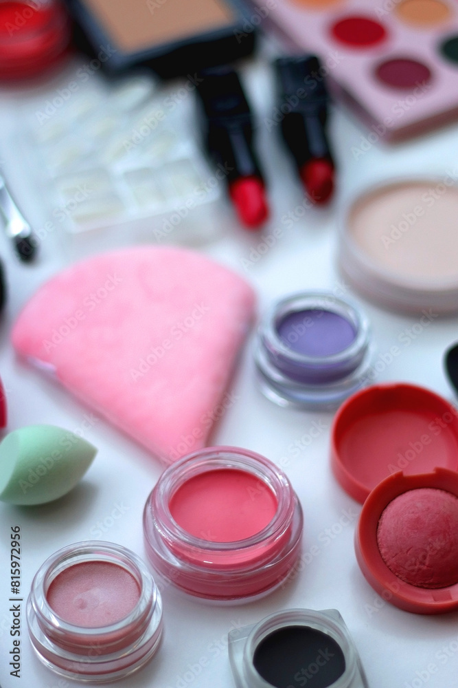 Naklejka premium Various colorful beauty products on white background. Selective focus.